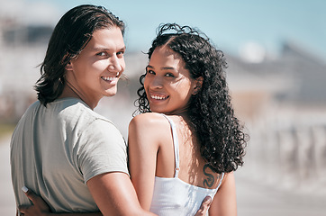 Image showing Portrait, hug and couple at the beach for travel, fun and walking against blurred background. Face, love and woman embracing man rear view on vacation, relax and bond on a trip together in Miami