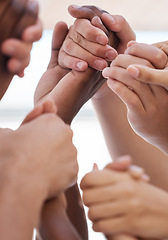 Image showing Praying, hand and people worship for peace, love and trust in God against blurred background. Church, christian and community group holding hands in prayer, faith or praise, belief and unity in Jesus