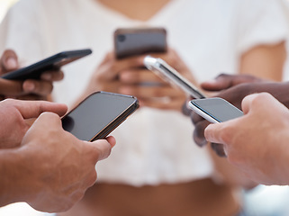 Image showing Hands, phone and people networking on social media, mobile app or chatting on mockup screen. Hand of group holding smartphone in circle for online network share, data sync or communication on display