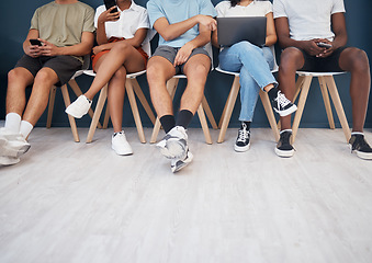 Image showing People, legs and sitting in waiting room networking for interview, social media or marketing team. Leg of group in wait with technology for network, hiring or recruitment on chairs in row on mockup