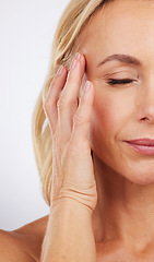 Image showing Closeup, skincare and woman with cosmetics, dermatology and morning routine against studio background. Zoom mature female and lady with grooming, luxury salon treatment and smooth skin on backdrop