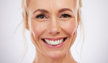 Image showing Teeth whitening, portrait and smile of woman in studio, beauty background and fresh mint breath. Happy female model, face and skincare for dental wellness, tooth implant and aesthetic facial salon