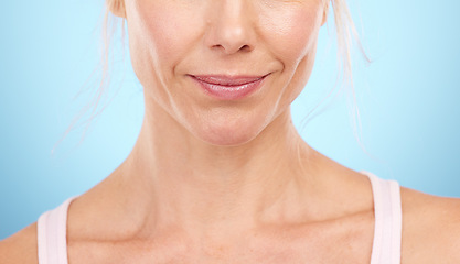 Image showing Woman, beauty and skincare with lips, mouth and aesthetic botox cosmetics on blue background. Closeup female model, lip filler and face for plastic surgery, facial wellness and dermatology in studio