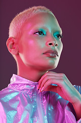 Image showing Beauty, cyberpunk and high fashion woman with unique style, makeup and hairstyle isolated in a studio neon background. Futuristic, artistic and bright and colorful female is trendy and stylish