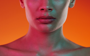 Image showing Woman, neon beauty and skincare with lips, mouth and aesthetic cosmetics on color background. Closeup female model, lip filler and face for plastic surgery, facial dermatology and cyberpunk art