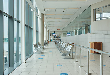 Image showing Background of airport corridor with chair, waiting room and global travel of covid regulations. Empty airplane lobby, seat and building interior design for transportation, furniture and clean space