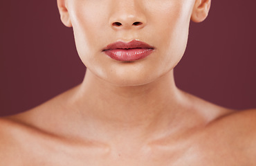 Image showing Lips, face makeup and beauty of woman in studio isolated on a red background. Skincare dermatology, lipstick cosmetics and female model with beautiful, glowing or healthy skin after facial treatment.