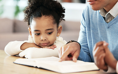 Image showing Books, serious and reading with man and children for education, fantasy or bonding. Youth, learning and story time with girl listening to fairytale in black family home for knowledge, study and hobby