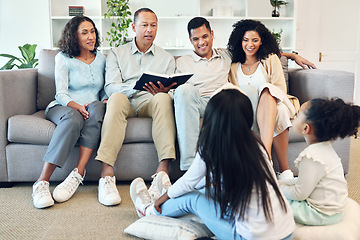 Image showing Senior family, storytelling and children book, teaching and learning bible, spiritual development or education in living room. Grandparents, mother and father with kids reading holy story or language