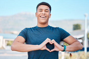 Image showing Portrait, heart hands and fitness man for self care, cardiology and workout health support in outdoor running. Face of sports person or athlete with love emoji or sign in street training or wellness