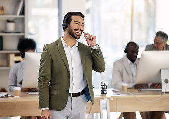 Image showing Call center, happy and consulting with man in office for customer support, telemarketing and advisory. Help desk, team leader and contact us with employee laughing for communication, sales and crm