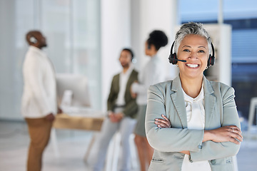 Image showing Senior woman, call center portrait and smile with arms crossed, teamwork and happiness by blurred background. Happy crm consultant, customer service expert or tech support leader in office for vision