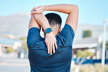 Image showing Back of man, stretching and exercise in city for wellness, training and healthy lifestyle goals. Sports person warm up arms, body and outdoor workout for fitness, energy or marathon running in street