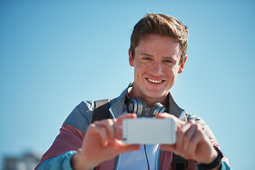 Image showing Young man with smartphone, photography outdoor with technology, photographer or content creator with smile. Travel blog, summer and taking picture with happy person, creative with adventure in Sydney