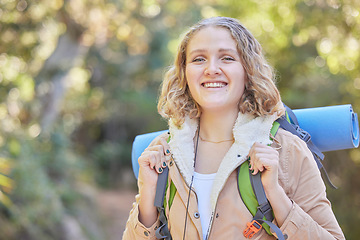 Image showing Hiking, smile and portrait of woman with backpack, sun and freedom, hiker on trekking adventure in nature. Health, fitness and camping, happy face of gen z person on hike in mountain or forest of USA