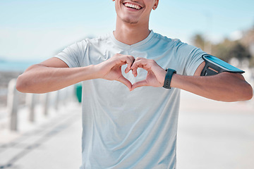 Image showing Fitness, hands in heart and man with smile ready to start workout, training and cardio exercise. Sports, love and male runner with shape in Miami city for wellness, healthy lifestyle and motivation