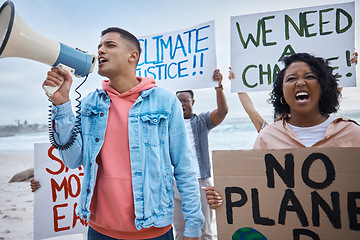 Image showing Protest, environment and climate change with man and megaphone on beach for nature, earth day and action. Global warming, community and stop pollution with activist for justice, support and freedom