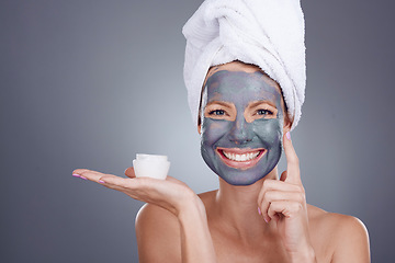 Image showing Clay jar, portrait and woman with mask of facial, healthy beauty spa or studio background. Face of female model, charcoal skincare product and happy cosmetics cream of acne, shower or aesthetic salon