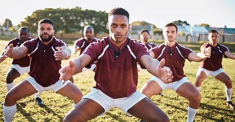 Image showing Rugby, haka or team with motivation, solidarity or support in a battle cry, war dance or challenge with unity. Performance, fitness group or athletes dancing before a game or match on a grass stadium
