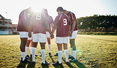 Image showing Rugby, field or team in a circle praying for motivation, solidarity or support after sports training. Young men, fitness or group of male athletes in unity before a game or match on a grass stadium