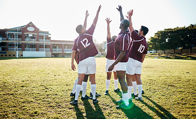 Image showing Man, sports and team in celebration for winning, victory or success in collaboration together on grass field. Sport men celebrating with hands in air for win, teamwork or partnership in solidarity