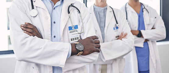 Image showing Teamwork, arms crossed and medical with hands of doctors for medicine, leadership or professional. Wellness, healthcare and trust with group of people in hospital for expert, confidence or consulting