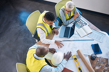 Image showing Architect, laptop and team in meeting above for construction or building planning strategy at office. Group of diverse engineers discussing floor plan, project layout or blueprints for architecture