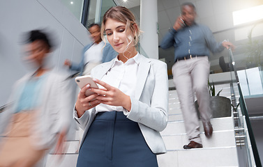 Image showing Business woman, smartphone at office with motion blur and communication, fast pace and busy with technology and wifi. Chat, email and social media, female and speed with movement and mobile app