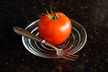 Image showing Fresh tomato on the glass plate.