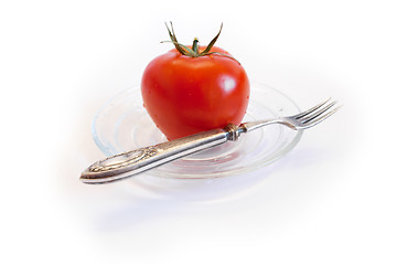 Image showing Isolated tomato on the glass plate.