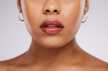 Image showing Makeup, beauty and mouth of woman with cosmetics for wellness, self care and skincare in studio. Luxury spa, salon and face zoom of girl for facial treatment, lipstick and glamour on white background