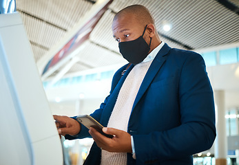 Image showing Covid, travel and self service with black man and phone in airport for online booking, ticket and technology. Vacation, business trip and kiosk with passenger typing for flight, airline and check in