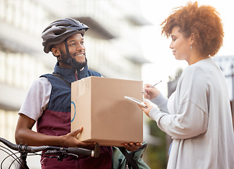 Image showing Black man, box and tablet in delivery service, package or parcel for female customer order in city. Happy African American male courier employee delivering cargo to woman with touchscreen signature