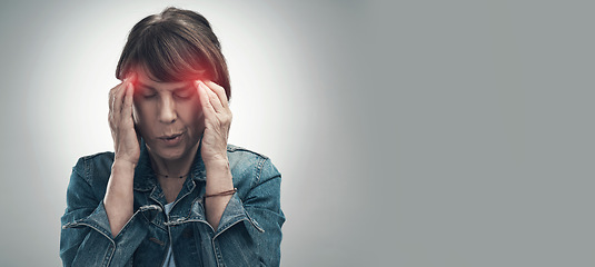 Image showing Headache, pain and hurt woman with a migraine in due to depression, frustrated and anxiety in mockup space. Red, overlay and discomfort by a female feeling sick isolated in a studio gray background