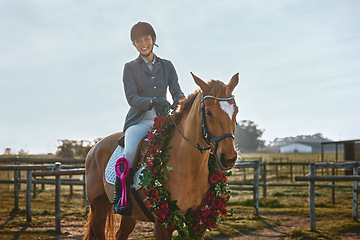 Image showing Winner, sports and portrait of woman on horse for a show, recreation and lessons on a farm. Equestrian, award and girl doing horseback riding for a competition, learning or training in countryside