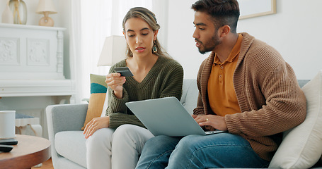 Image showing Laptop, living room and couple search website information for home investment, loan or real estate property discussion on sofa. Young people on couch with pc internet, planning future together