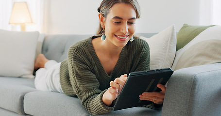 Image showing Woman, digital tablet and living room app, typing and reading ebook, online shopping and 5g multimedia technology on sofa home lounge. Relax girl on social media, internet website and wifi connection