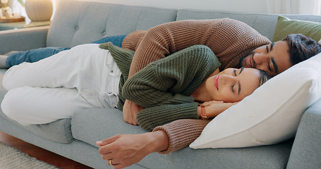 Image showing Kiss, smile and couple sleeping on the sofa in the living room of their house together. Relax, happy and calm man and woman tired and cuddling on the couch in their home with affection and love