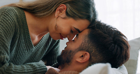 Image showing Interracial, couple, love and kiss being happy, bonding and embrace for communication, talking together and at home. Romantic, man and woman with smile, intimate and being loving for romance or hug