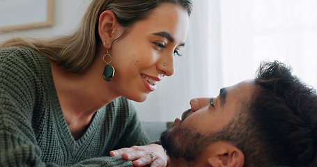Image showing Interracial, couple, love and kiss being happy, bonding and embrace for communication, talking together and at home. Romantic, man and woman with smile, intimate and being loving for romance or hug