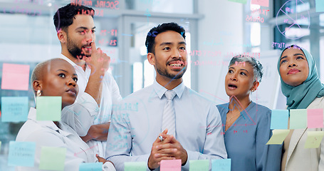 Image showing Meeting, collaboration and sticky notes with a business man training a team while planning strategy on glass in an office. Teamwork, diversity and workshop with a man and woman employee group at work