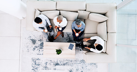 Image showing Corporate, lounge and business people on couch, relax and talk during lunch break with company chill spot top view. Diversity, social and employee group together with tablet and coffee break