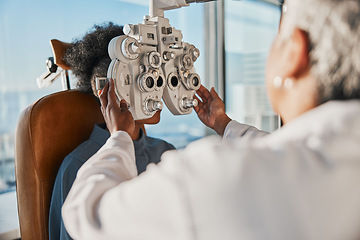 Image showing Optometry, healthcare and optometrist doing a eye test for a patient for vision or eyecare in a clinic. Ophthalmology, medical and female optician doing exam for prescription lenses in optical store.