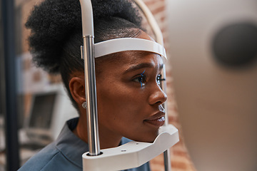 Image showing Optometry, healthcare and woman doing eye test at a clinic for optic wellness, health and vision. Medical, ophthalmology and African female patient doing optical exam for prescription lenses in store