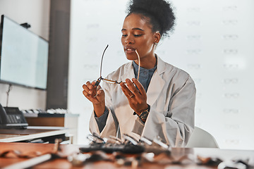 Image showing Optometry, repair and optometrist fixing glasses for prescription frame in the optic clinic. Healthcare, vision and African female optician doing maintenance on eyewear or spectacles in optical store