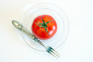 Image showing Fresh tomato on the glass plate.