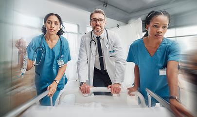 Image showing Doctor, team and rush in healthcare emergency for surgery or operation in hurry pushing hospital bed. Senior medical expert rushing patient with nursing coworkers to intensive care or theatre clinic