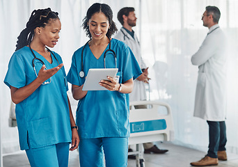 Image showing Tablet, medical and female doctors in the hospital in discussion after a team consultation. Teamwork, collaboration and professional women healthcare workers on a mobile device at a medicare clinic.