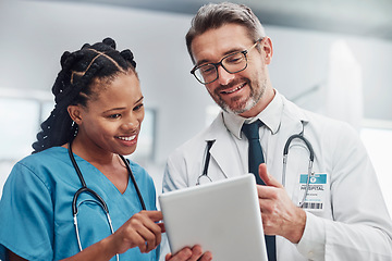 Image showing Healthcare, research and doctors with tablet, conversation or data analytics in hospital. Medical professionals, black woman or man with device, discussion or search internet for cure or update chart