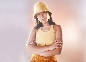 Image showing Arms crossed, fashion and portrait of an Asian woman with style isolated on a studio background. Trendy, funky and confident Japanese model with empowerment, expression and edgy on a backdrop